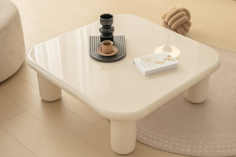 Pebble Companions Soft Hue Arc-Edge Coffee Table by Acanva