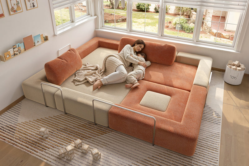 Children playing on modular kids play sofa in cream and orange colors – CushyLand by Acanva 11