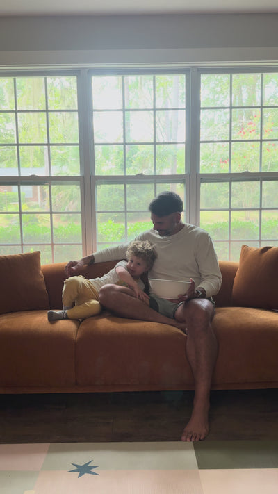 Video showing a cozy family moment on the beryl curved 3-seater couch sofa and lounge chair, with relaxed seating and everyday time at home.